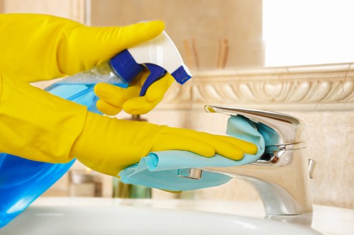 Technician treating a carpet stain during a service visit
